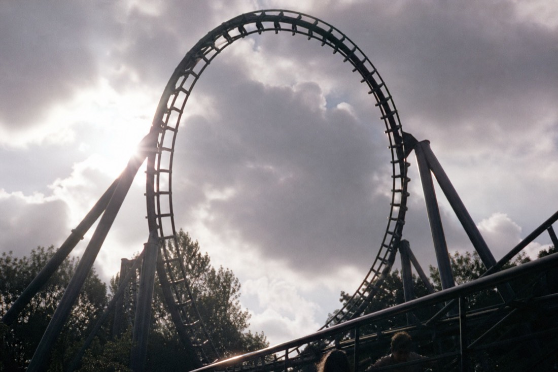 Vertical loop of coaster track towering overhead, the scale that makes the world's scariest roller coasters