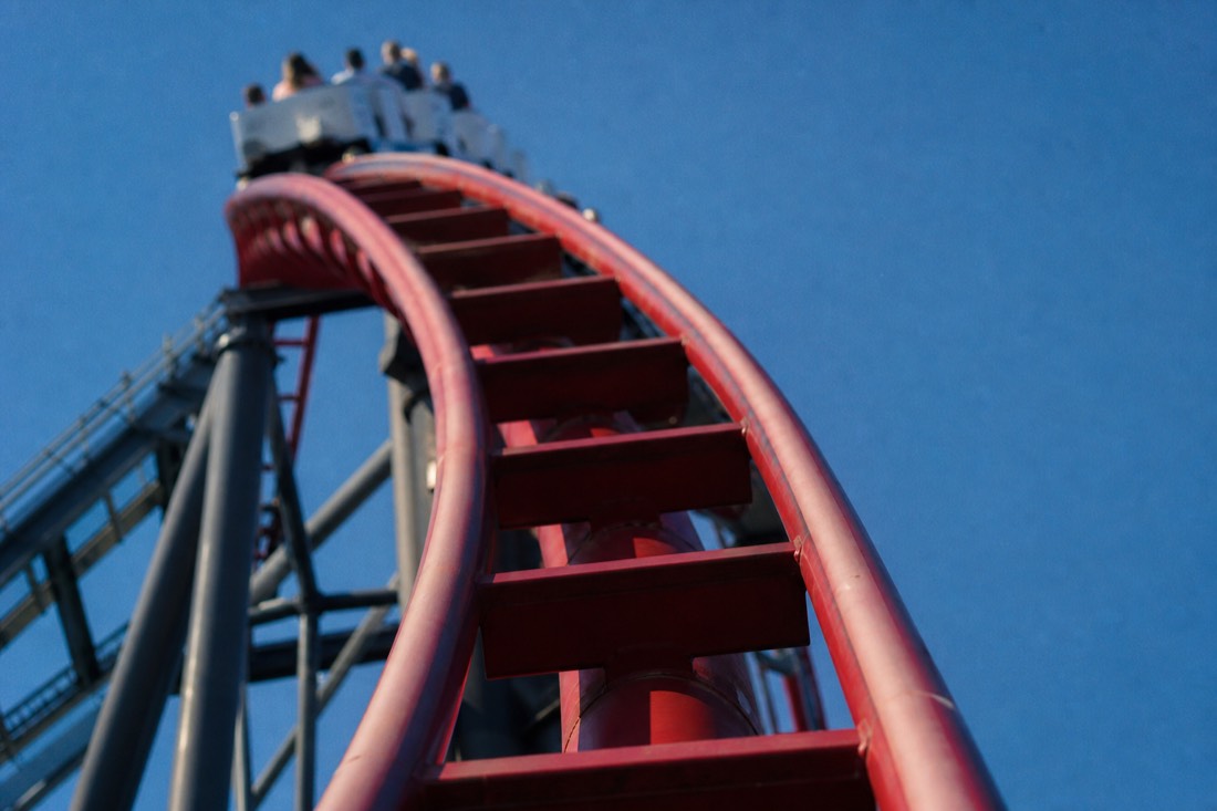Coaster rails bending beyond vertical over a drop like Takabisha's 121 degrees