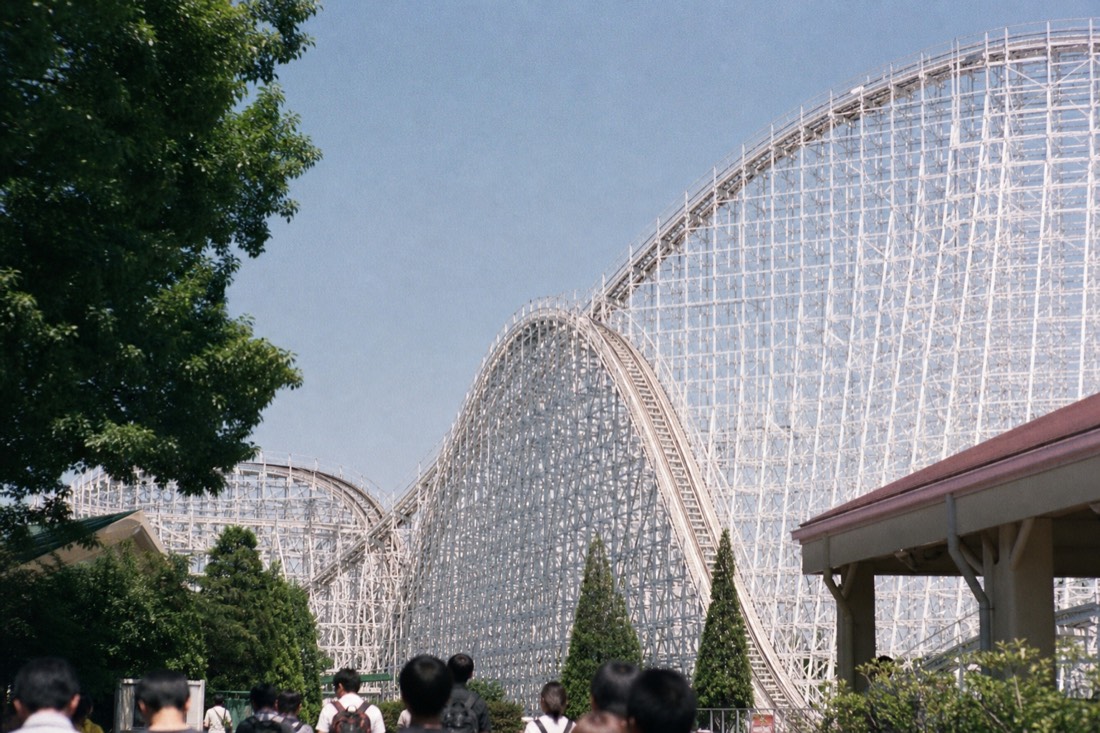 White classic steel coaster structure like Fujiyama at Fuji-Q Highland