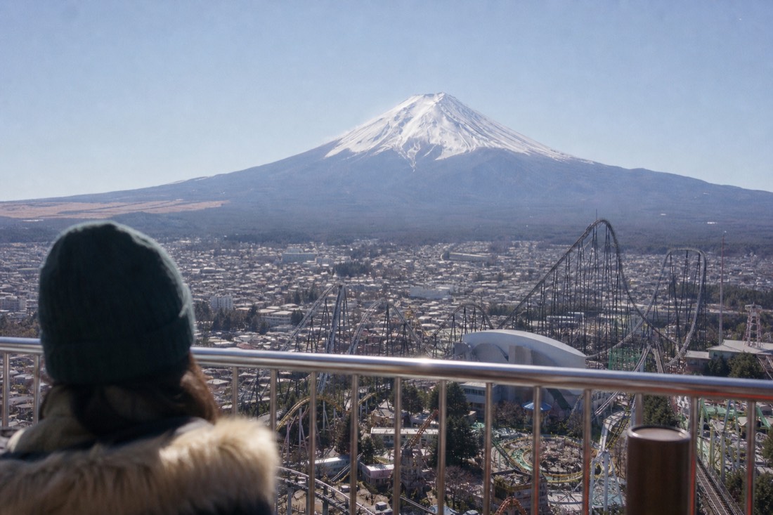 Observation deck view over Fuji-Q Highland with Mount Fuji filling the horizon